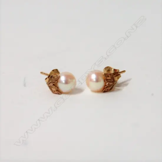 A pair of 14ct. yellow gold and Mikimoto pearl earrings