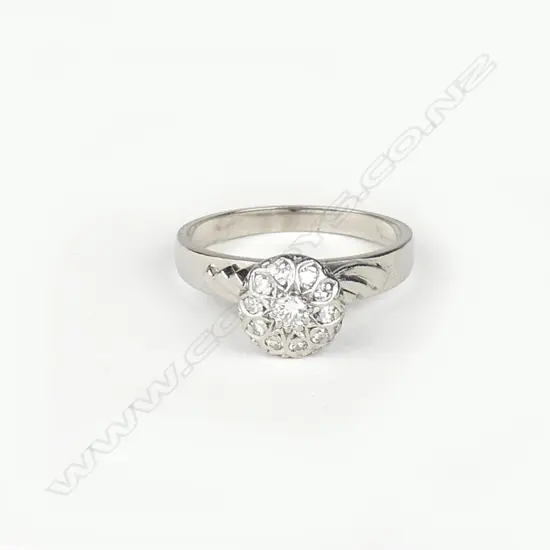 An 18ct. white gold and diamond cluster ring