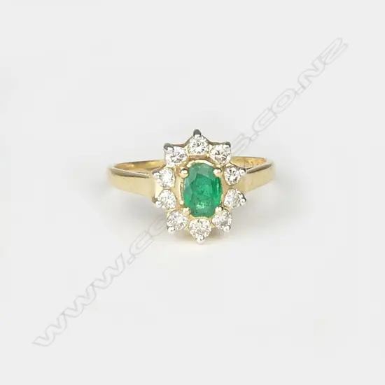 A 14ct gold emerald and diamond ring