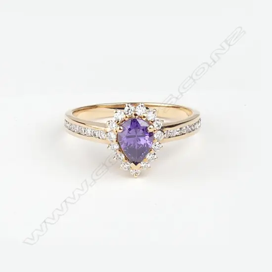 A modern lady's 18ct. rose gold amethyst and diamond ring