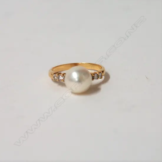 An 18ct. yellow gold cultured pearl and diamond dress ring