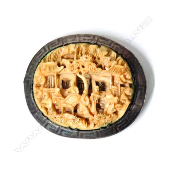 A 19thC Chinese finely carved ivory and silver brooch