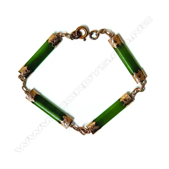 An Edwardian greenstone bar and gold mounted bracelet