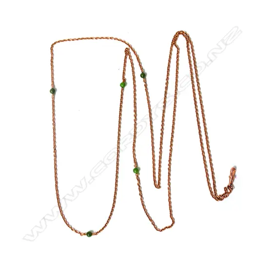 A good early 20thC 15ct. rose gold and greenstone highlighted muff chain