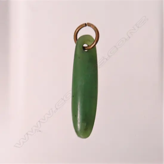 An old greenstone pendant of torpedo form