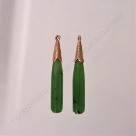 A pair of early 20thC greenstone and gold mounted earrings