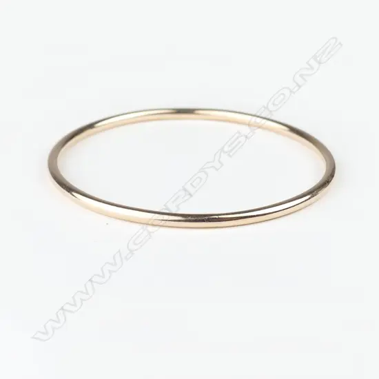 A c.1900 9ct. rose gold bangle made by William Good of Gisborne