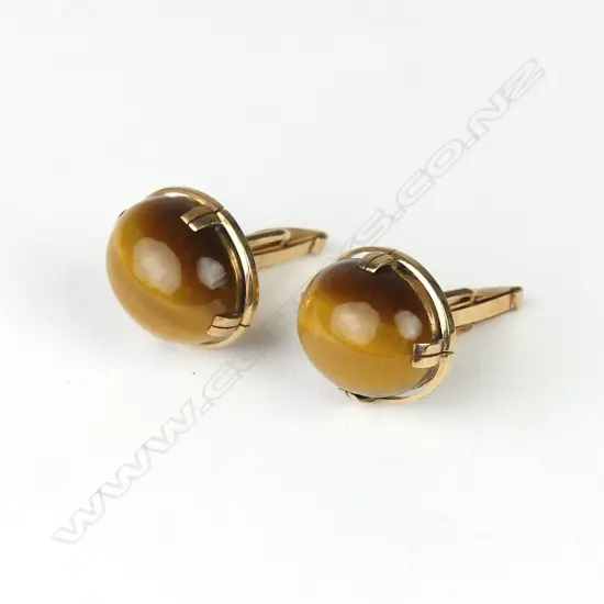 A pair of 9ct rose gold and tiger's eye cufflinks