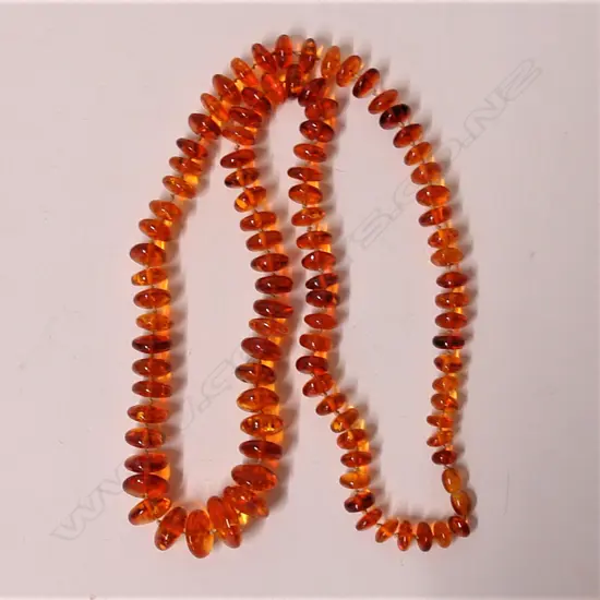 A long amber disc bead necklace