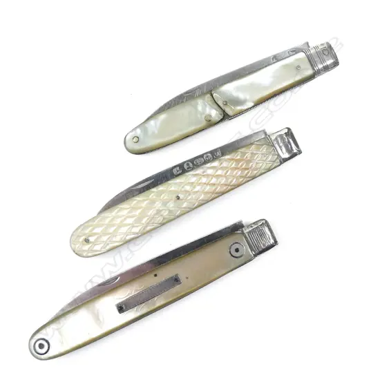 Three Georgian silver and mother-of-pearl folding fruit knives