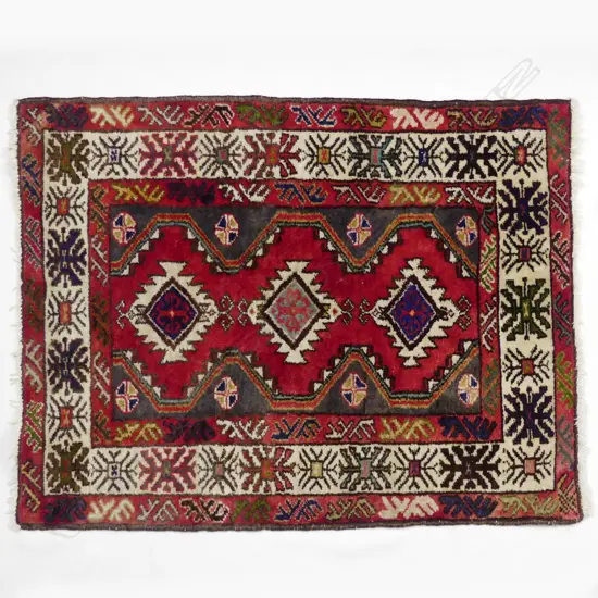 A Turkish hand knotted wool rug
