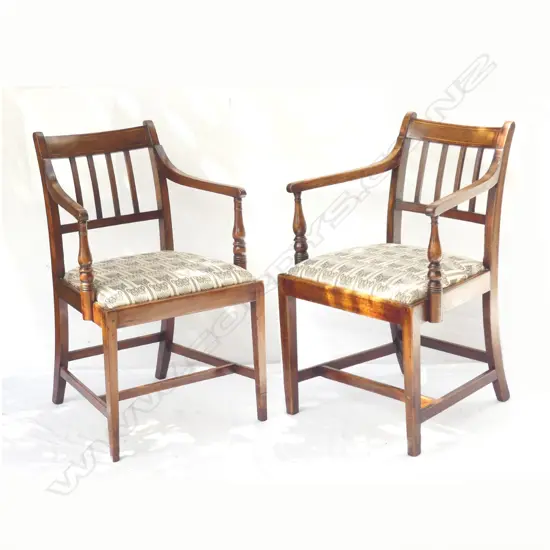A pair of Edwardian mahogany Sheraton Revival carver chairs