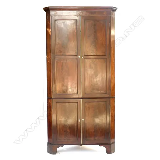 A Georgian mahogany floor standing corner cabinet