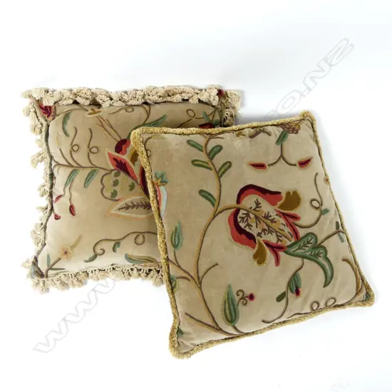 A pair of vintage velvet and embroidered cushions