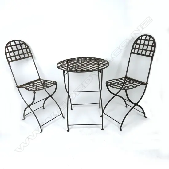 A French wrought iron outdoor table and chairs