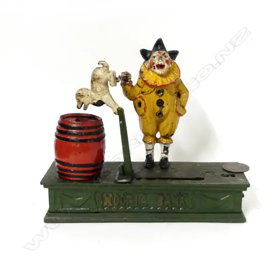 A 1920s English Hoop-la Clown and Trick Dog cast-iron moneybox