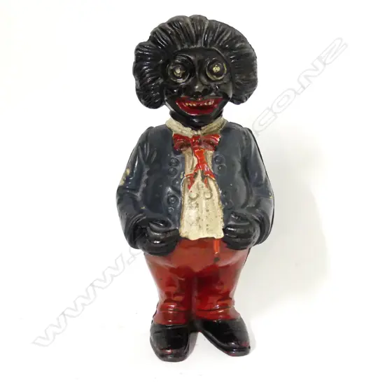 A c.1910 English cast-iron standing Golliwog moneybox