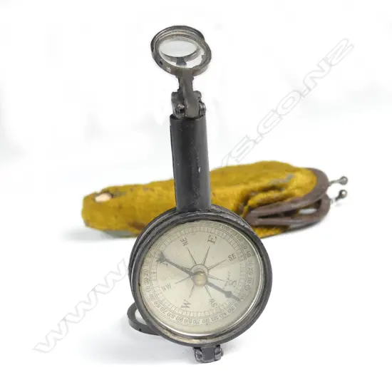 An unusual French vintage pair of folding binoculars with inbuilt compass and signalling mirror