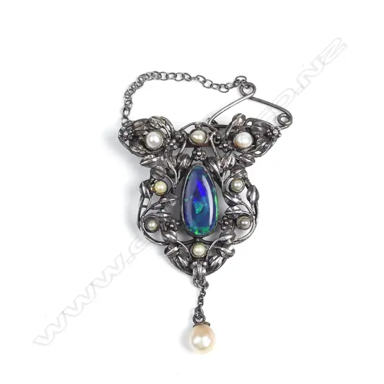 A silver opal and pearl brooch
