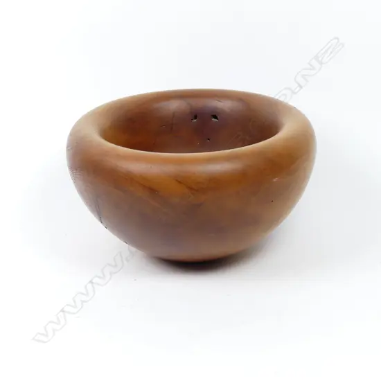A solid kauri turned wooden bowl
