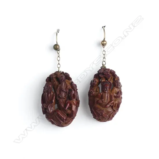 A pair of Chinese carved half nut earrings