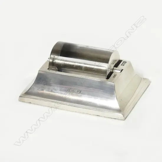 An Edwardian silver framed glass stamp roller