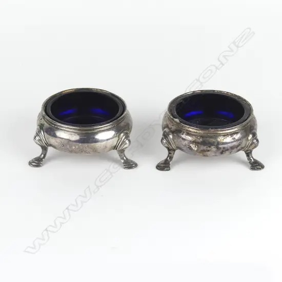 A pair of George II silver cauldron salts