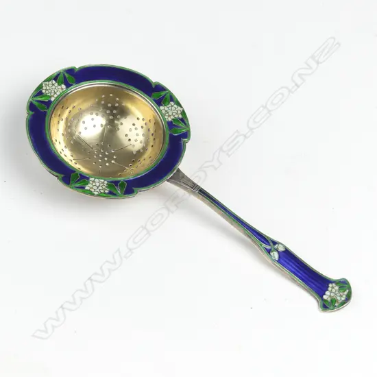A c.1920s Scandinavian enamelled silver tea strainer