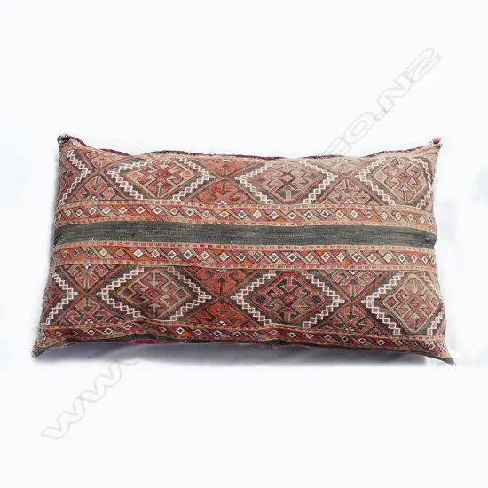 A kilim bolster cushion