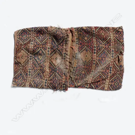 An old and worn Turkish kilim saddlebag
