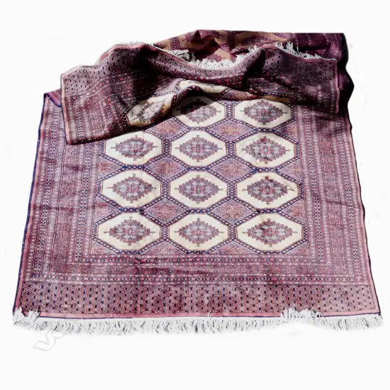 A Bokhara hand knotted rug