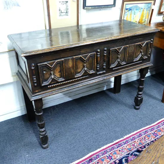 An oak Jacobean style dresser base