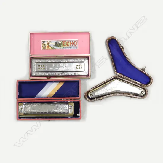 Three cased harmonicas