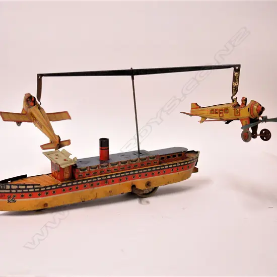 An early 20thC German Kellerman tin plate ship and plane merry-go-round toy