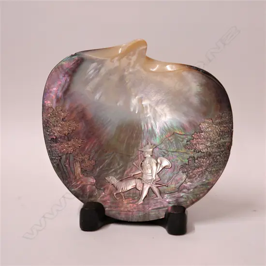 An early 20thC finely carved mother-of-pearl shell