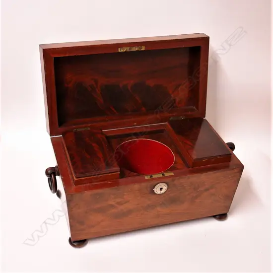A Regency flame mahogany tea caddy