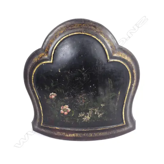 An uncommon toleware fire screen