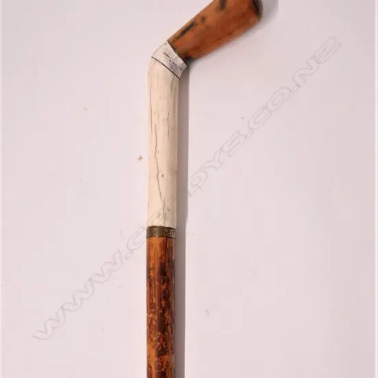 A vintage malacca cane and bone walking stick