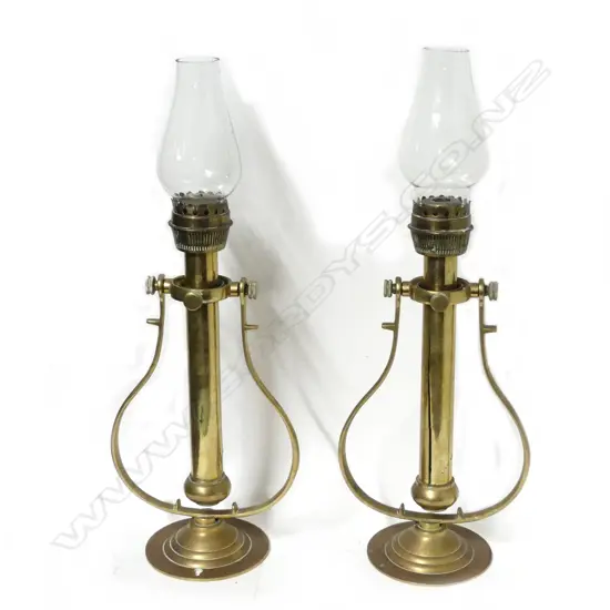 A pair brass ship's gimbal candle lamps