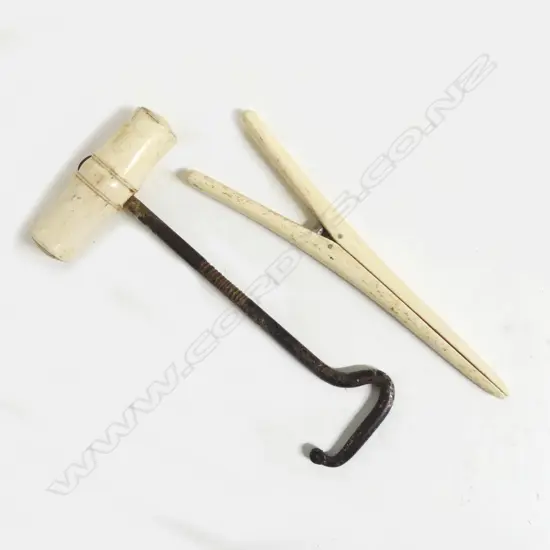 A bone handled boot pull and glove stretchers