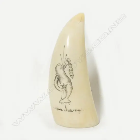 A small scrimshaw ivory tooth