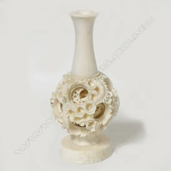 A vintage Chinese carved ivory puzzle ball vase