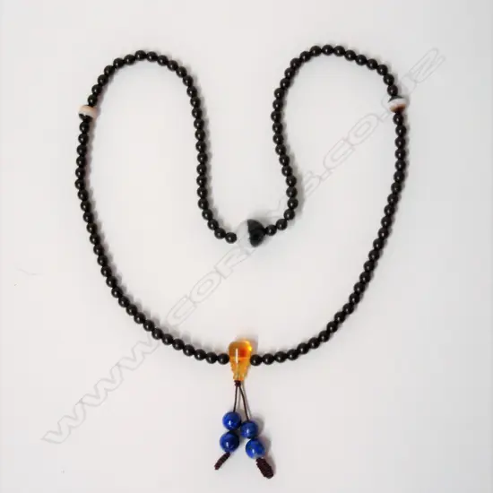 A rosewood bead mala necklace