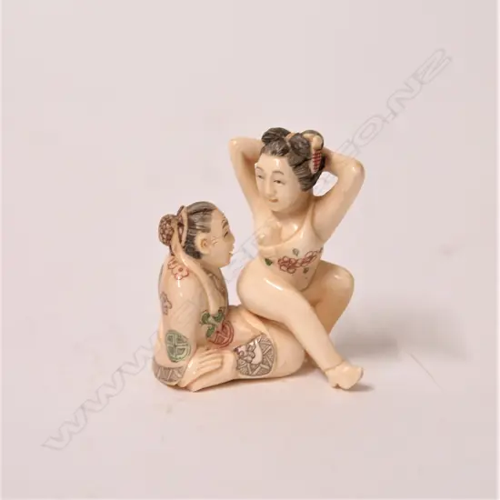 A vintage carved ivory erotic netsuke