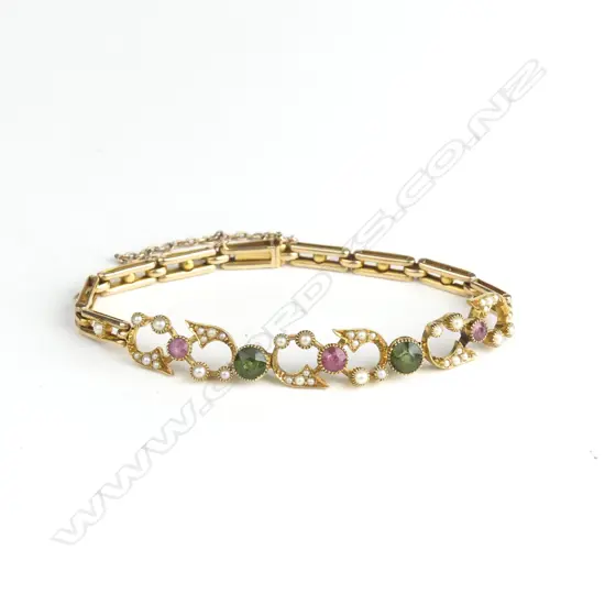 An Edwardian attractive 15ct. yellow gold tourmaline and seed pearl lady's bracelet