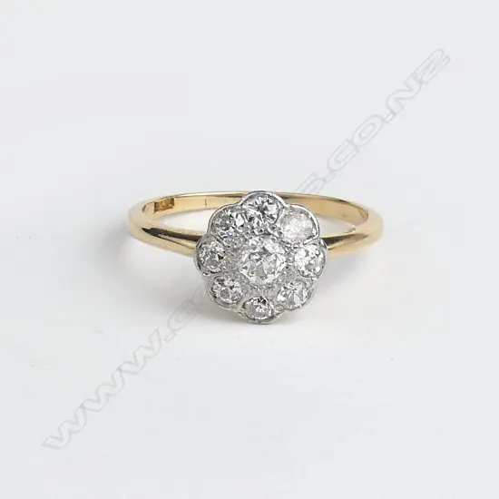 A lady's estate 18ct. yellow gold and diamond cluster ring