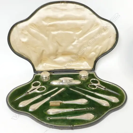 An Edwardian silver twelve piece manicure and toilette set