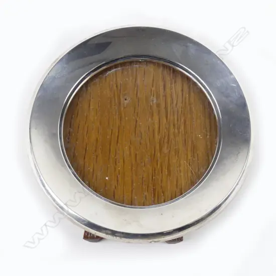 An early 20thC silver fronted circular photo frame