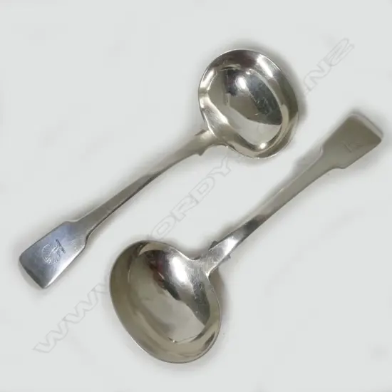 A pair of George IV silver sauce ladles