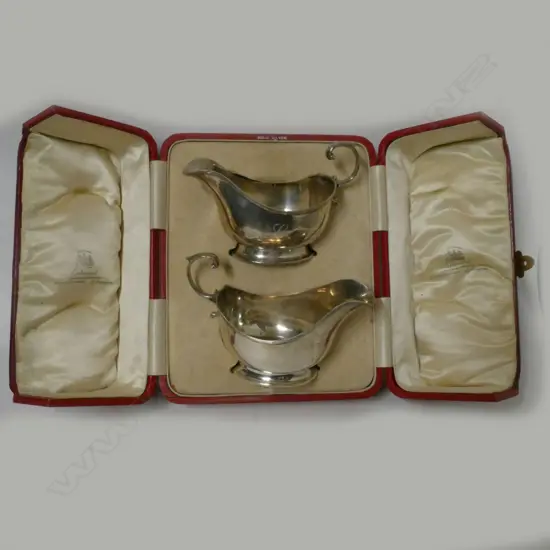 A pair of silver sauce boats